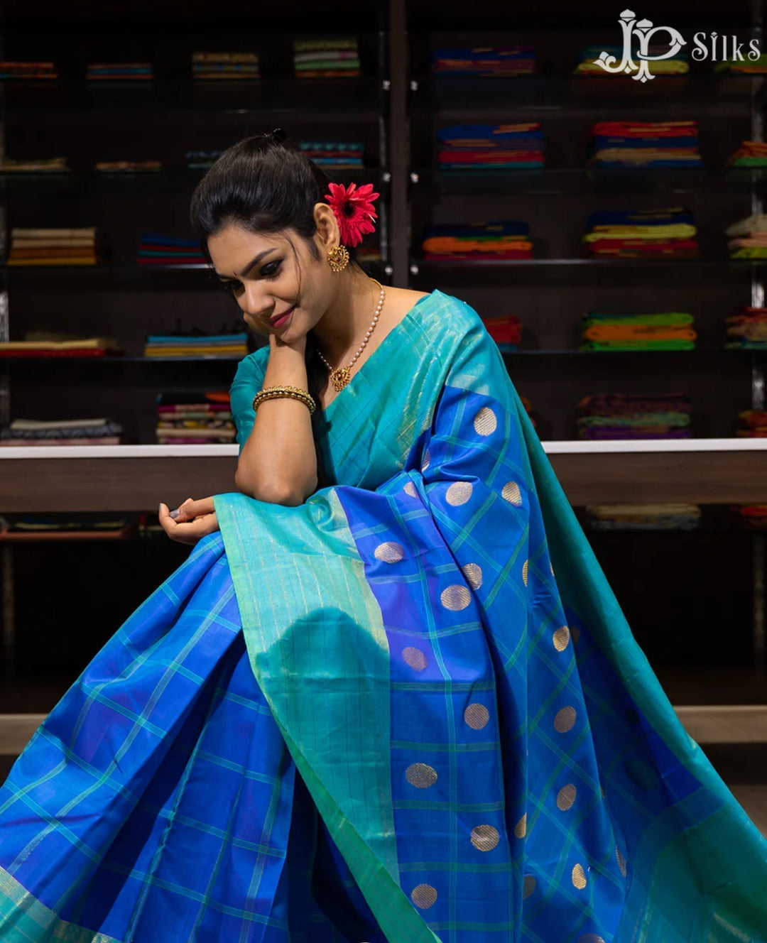 https://jpsilks.com/products/dual-shade-blue-and-peacock-green-pure-kanchipuram-silk-saree-f3372?pr_prod_strat=e5_desc&pr_rec_id=3004131c8&pr_rec_pid=10185299296529&pr_ref_pid=10629080580369&pr_seq=uniform