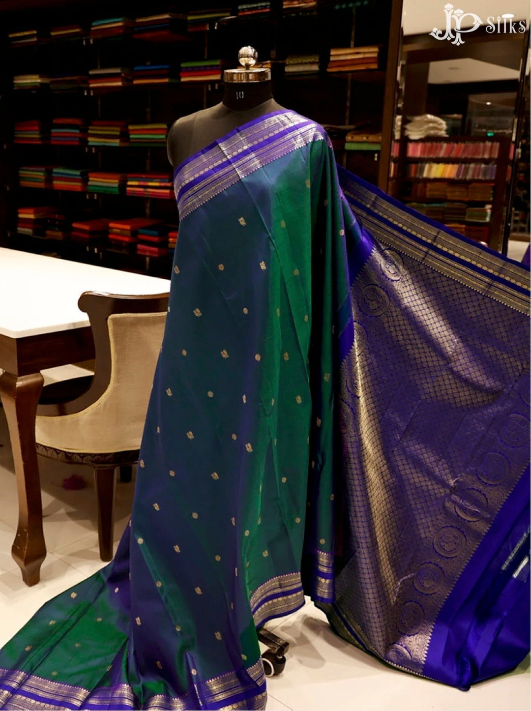 https://jpsilks.com/collections/kanchipuram-silk/products/mayilkazhuthu-blue-dark-blue-kanchipuram-silk-saree-g828