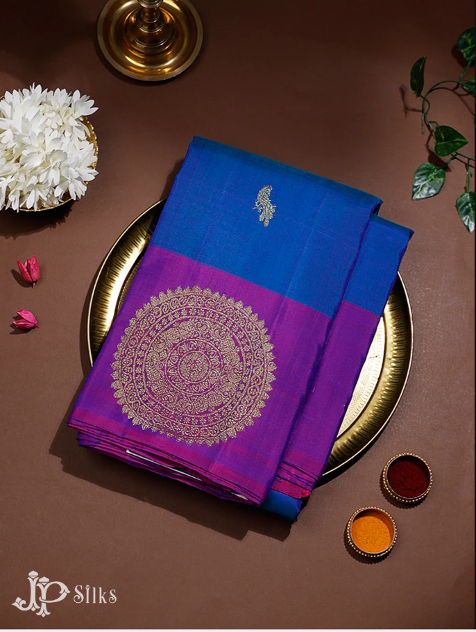https://jpsilks.com/collections/kanchipuram-silk/products/peacock-blue-purple-kanchipuram-silk-saree-f7