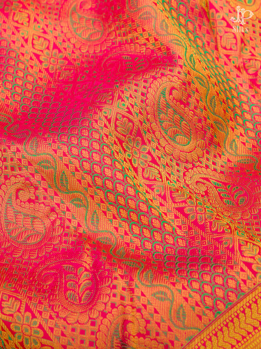 Elegant JP Silks Saree in vibrant pink with intricate gold paisley and geometric patterns